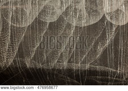 Yacht Hull At The Waterline, With Traces Of Salt, Dried Water And Scratches, In Black And White. Mon