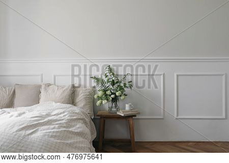 Cup Of Coffee, Tea On Wooden Night Stand. Green Bouquet Of White Viburnum, Fern And Solomons Seal Fl