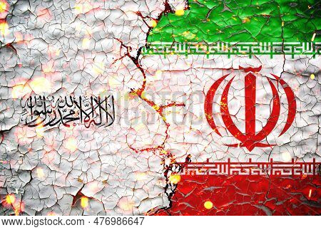 Taliban And Iran Flag Paint Over On Cracked Wall. Taliban Vs Iran Concept.