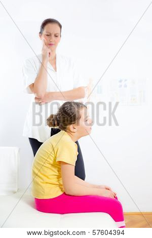 Femile Chiropractor doing adjustment on female patient