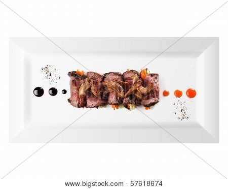 cold appetizer of meat in plate on white background