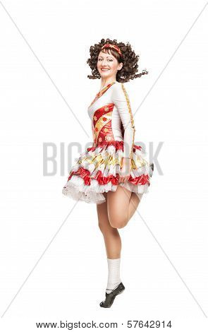 Young Woman In Irish Dance Dress Dancing Isolated