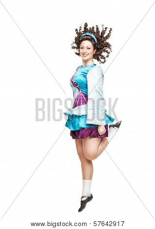Young Woman In Irish Dance Dress Dancing Isolated
