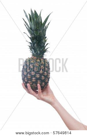 Wooman's hand with pineapple isolated on white
