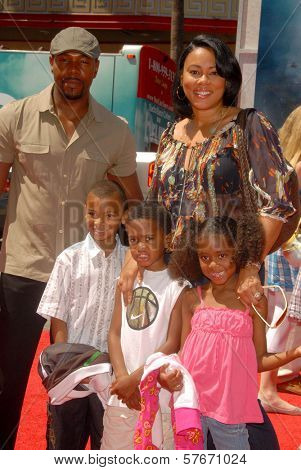 Antoine Fuqua with Lela Rochon and family at the World Premiere of 'G-Force'. El Capitan Theatre, Hollywood, CA. 07-19-09