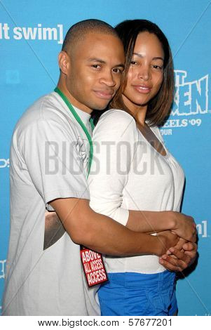 Eugene Byrd and Cathy Doe  at Robot Chicken's Skate Party Bus Tour. Skateland, Northridge, CA. 08-01-09