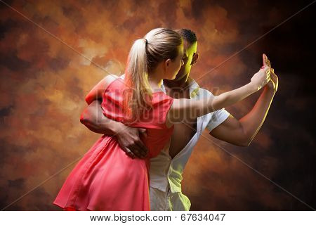 Young couple dances Caribbean Salsa