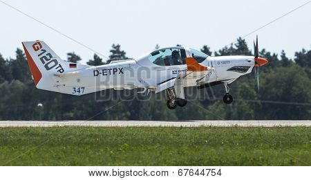 BERLIN, GERMANY - MAY 20, 2014: Two seated training and aerobatic low-wing aircraft Grob G120 TR (Germany), demonstration during the International Aerospace Exhibition ILA Berlin Air Show.