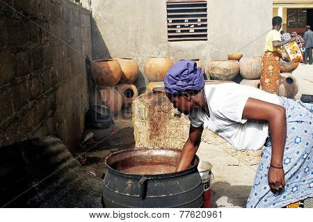 A Woman Takes Care Of The Cooking