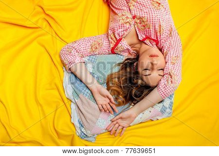 girl sleeping on the yellow sheet