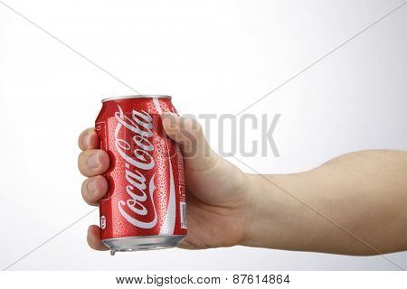 Kuala Lumpur,Malaysia 9th April 2015, hand holding a red Coca Cola can drinks.Coca Cola drinks are produced and manufactured by The Coca-Cola Company