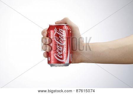 Kuala Lumpur,Malaysia 9th April 2015, hand holding a red Coca Cola can drinks.Coca Cola drinks are produced and manufactured by The Coca-Cola Company