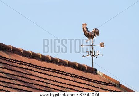 Copper Weathercock On The Rooftop