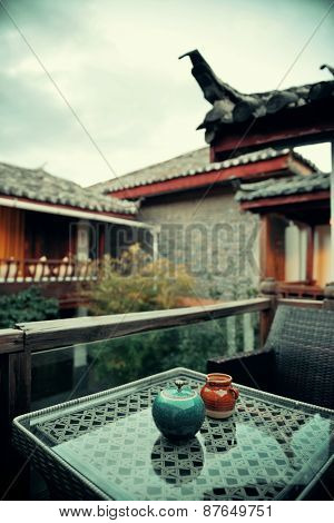 Old Naxi style courtyard and tea pot  in Lijiang, Yunnan, China.
