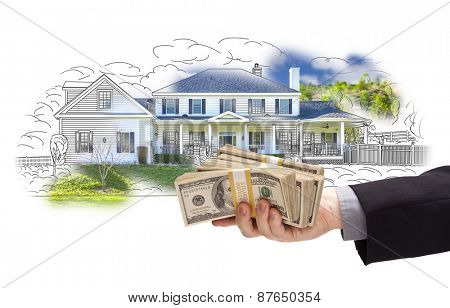 Hand Holding Thousands of Dollars In Cash Over House Drawing and Photo Area.