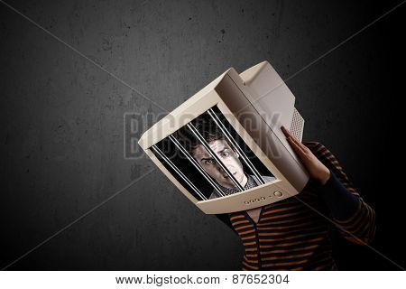 Business man with monitor screen on his head traped into a digital system concept