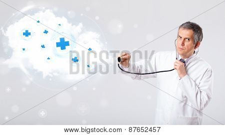 Proffesional doctor listening to abstract cloud with medical signs