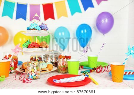 Prepared birthday table with sweets for children party