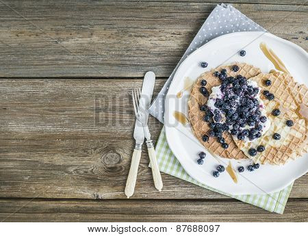Dutch Waffles With Cream-cheese, Fresh Blueberry And Maple Syrup On A White Ceramic Plate Over A Rou