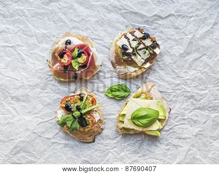 Antipasti Brusquetta Set On A White Pergament