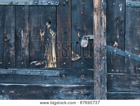 Old Rustic Faded Wood Gate With A Lock