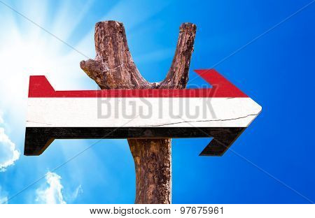 Yemen Flag wooden sign with sky background