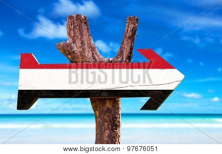 Yemen Flag wooden sign with coast background