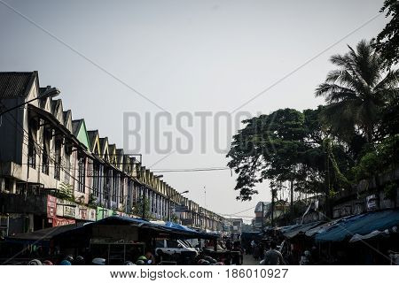 store in serius with cloud and plam tree photo takein indonesia bogor java