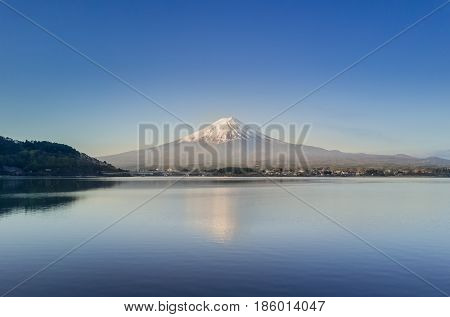 Mountain Fuji reflected in Kawaguchiko lake on a sunny day and clear sky, Yamanashi Japan