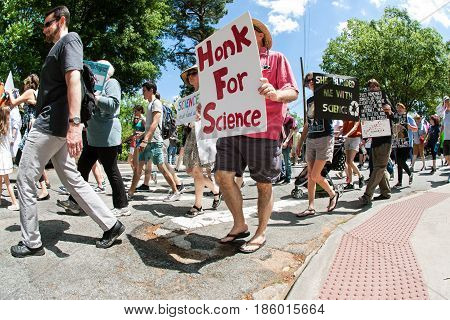 ATLANTA, GA - APRIL 22:  A man holds up a sign that says 