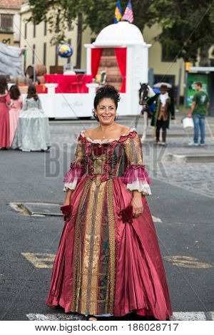 FUNCHAL MADEIRA PORTUGAL - SEPTEMBER 4 2016: Woman in historical fashion dress durnig historical and ethnographic parade of Madeira Wine Festival in Funchal. Madeira Portugal