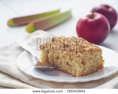 Rhubarb and strawberry crumble pie. Homemade biscuit cake decorated with crumbs. Summer fruits cake. Selective focus.