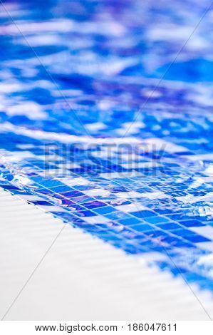 Border Of Indoor Pool With Mosaic Blue And White Tiles