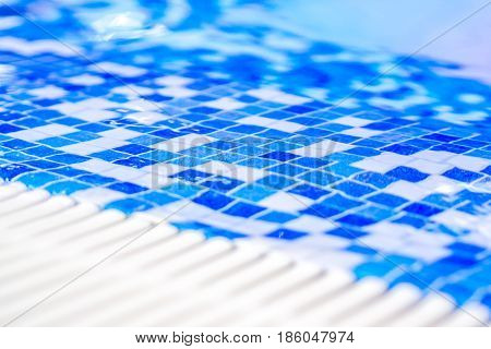 Border Of Indoor Pool With Mosaic Blue And White Tiles