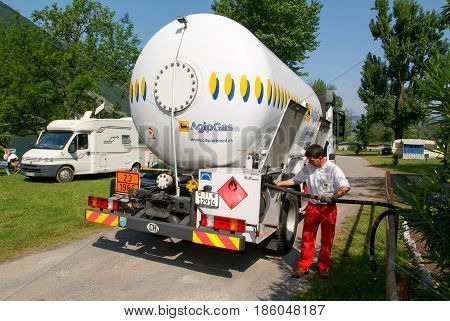 Worker Making Gas Supply On A Tank In The Garden