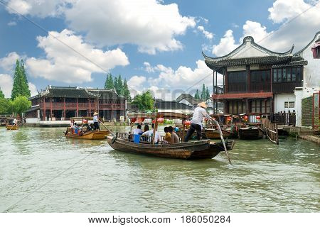 China traditional tourist boats on canals of Shanghai Zhujiajiao Water Town in Shanghai China
