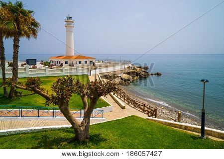 White lighthouse with orange roof Torrox Spain