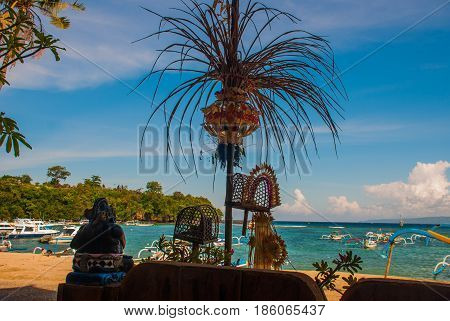 Padangbai Beach. Bali Island Indonesia.the Port With Boats And Traditional Balinese Decorations