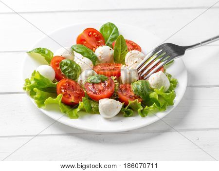 Nice big plate of delicious vegeterian salad with spinach and feta chesse, healthy eating