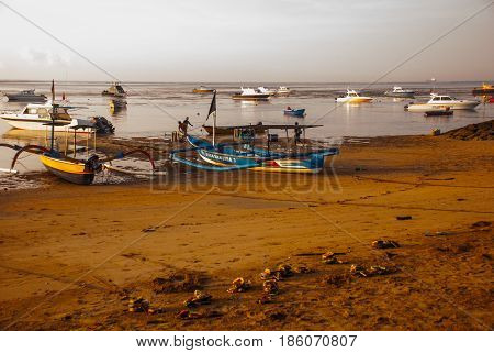 Traditional Balinese Ships Jukung In Sanur Beach At Sunrise, Bali, Indonesia