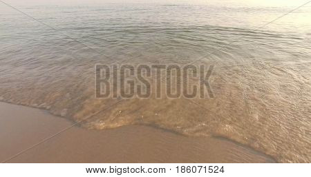 Aerial view of Baltic sea shore, waves and sandy beach. Lubiatowo, Poland