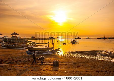Traditional Balinese Boats And Pavilion In Sanur Beach In The Morning At Dawn, Bali, Indonesia.
