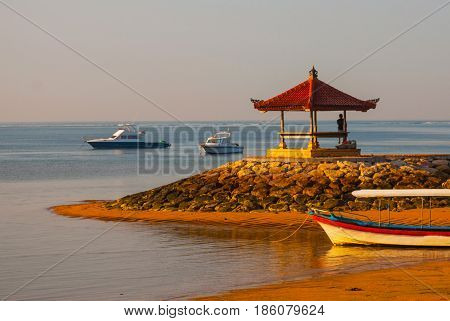 Balinese Boats And Pavilion In Sanur Beach In The Morning At Dawn, Bali, Indonesia.