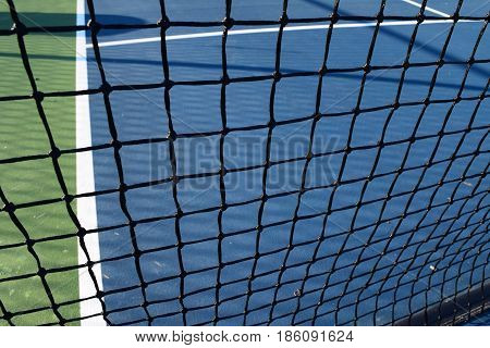 empty pickleball court and netting for playing