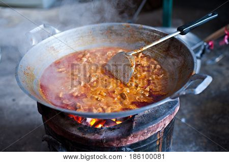 A cooking thai food in the kicthen