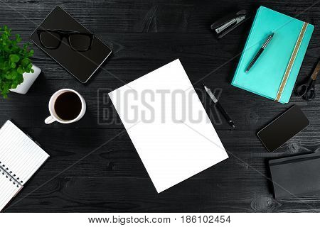 View from above with copy space office table , notebook with cup of coffee and Smart Phon. Women's table