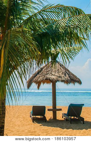 Sun Loungers And Parasols On The Beach. Bali, Indonesia, Tanjung Benoa. Nusa Dua.