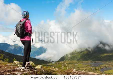 Hiker on the mountain top. Sport and active life concept. Trolltunga Norway