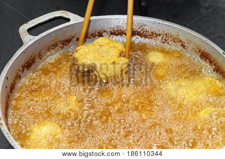 Frying Fish In A Pan With Boiling Oil