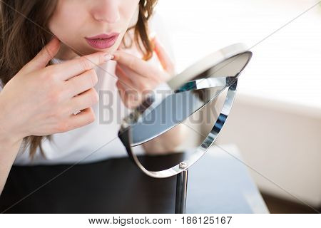 Woman With A Mirror